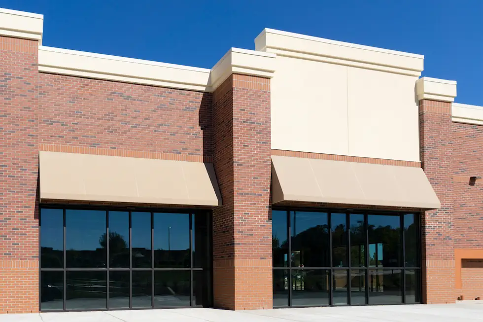 glass storefront with awning
